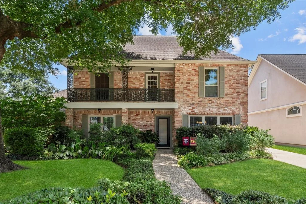 Two-story brick exterior and balcony at 9103 Herts Road